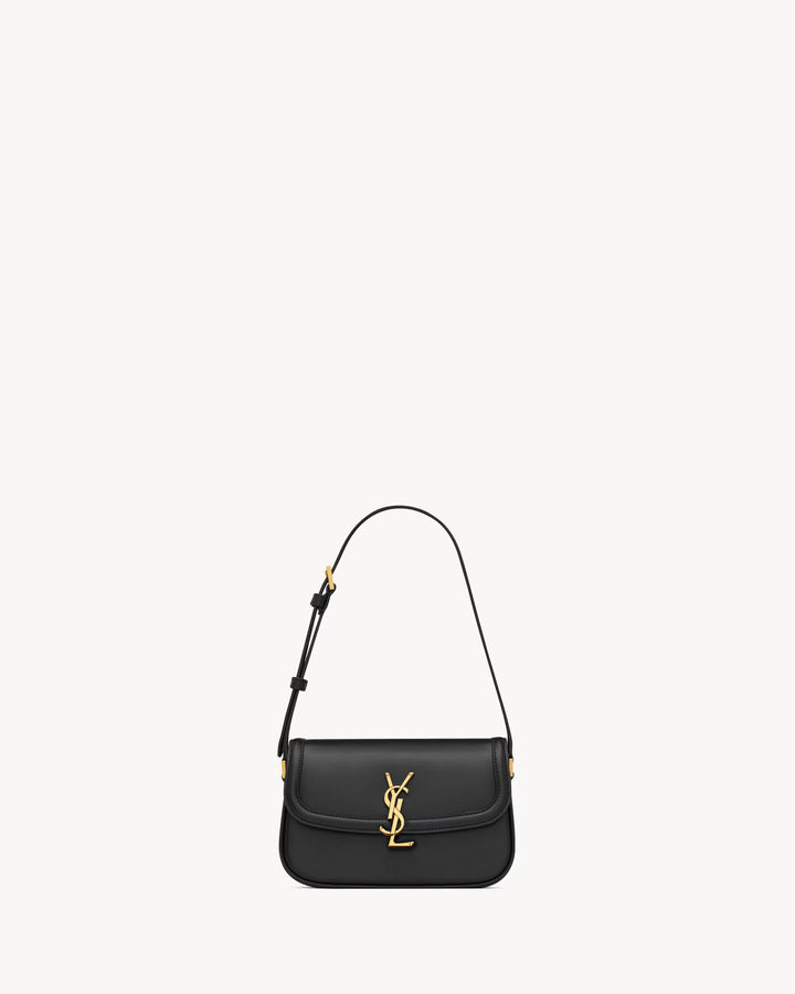 SAINT LAURENT - Sac en cuir box muni d'un fermoir cassandre.