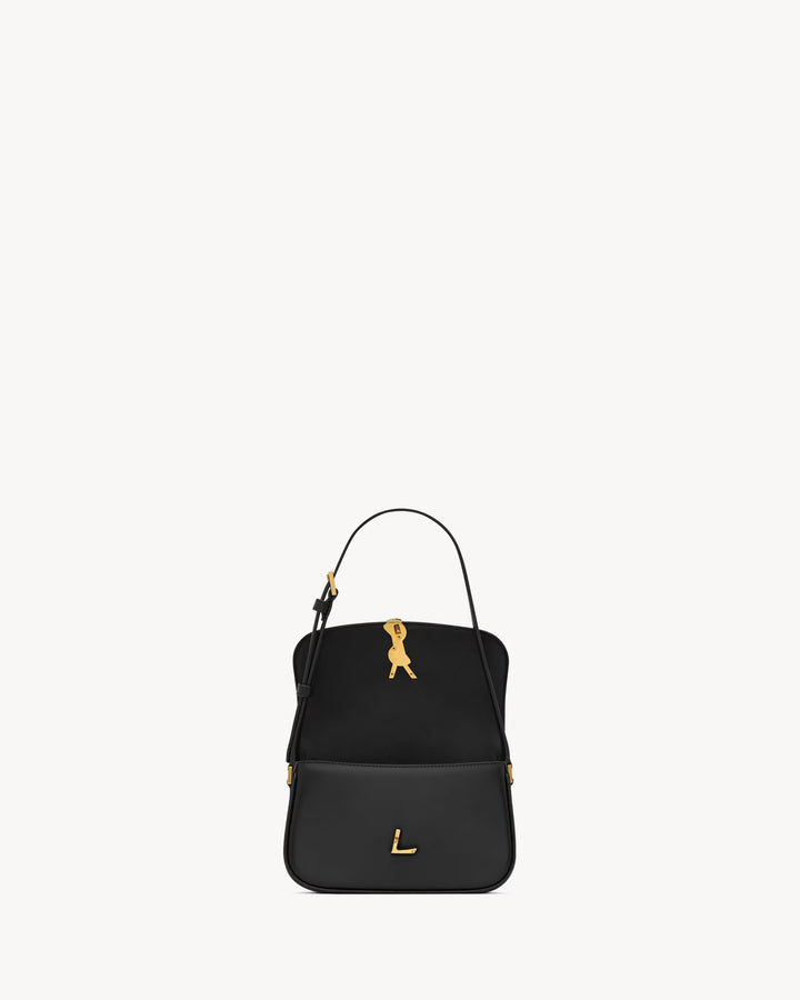 SAINT LAURENT - Sac en cuir box muni d'un fermoir cassandre.